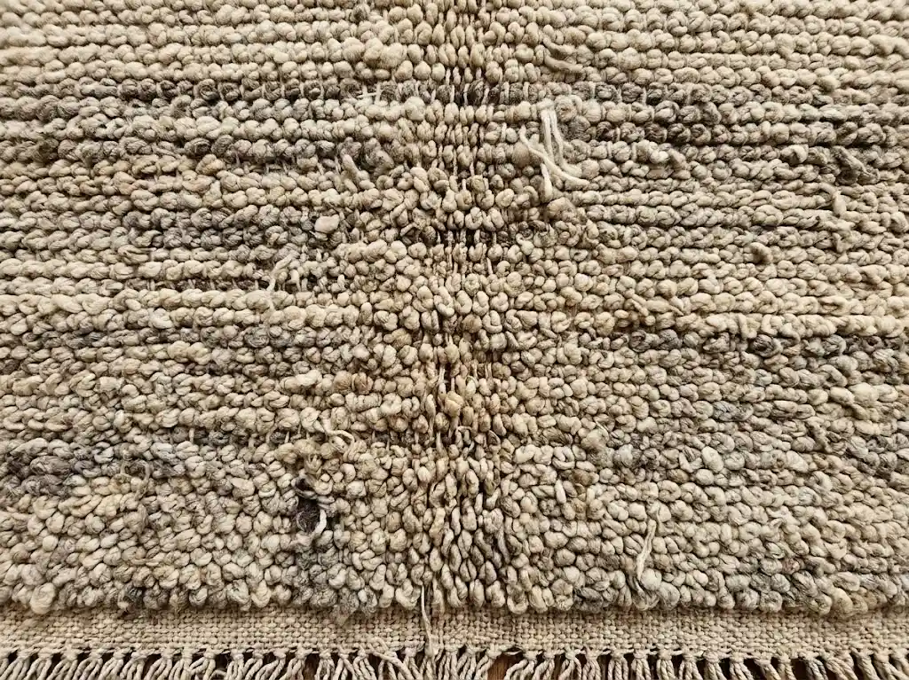Back of a handwoven Berber rug showing authentic hand-knotting